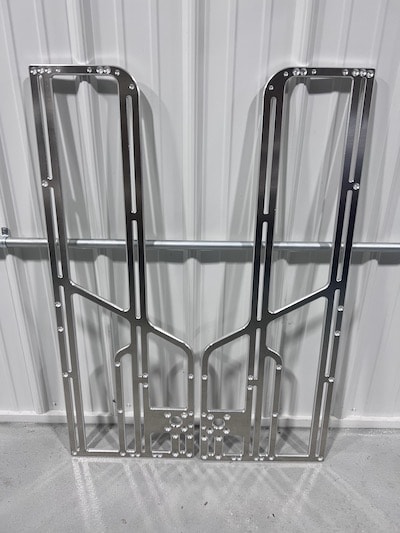 The very first Pasq ADV1 sides cut from 3/8" 6061-T6 aluminum plate using industrial CNC routers.
