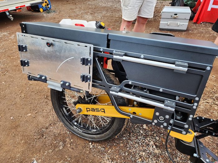 The Pasq ADV1 single-wheel adventure motorcycle trailer from the side, closeup