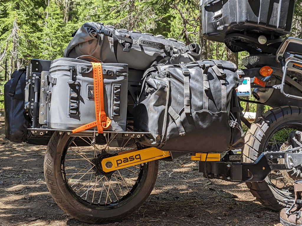 A closeup of the Pasq ADV1 moto trailer with a cooler and Giant Loop base on it.