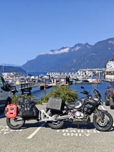 The Pasq ADV1 single-wheel moto trailer taking its rightful place in a "Trailers Only" parking spot.